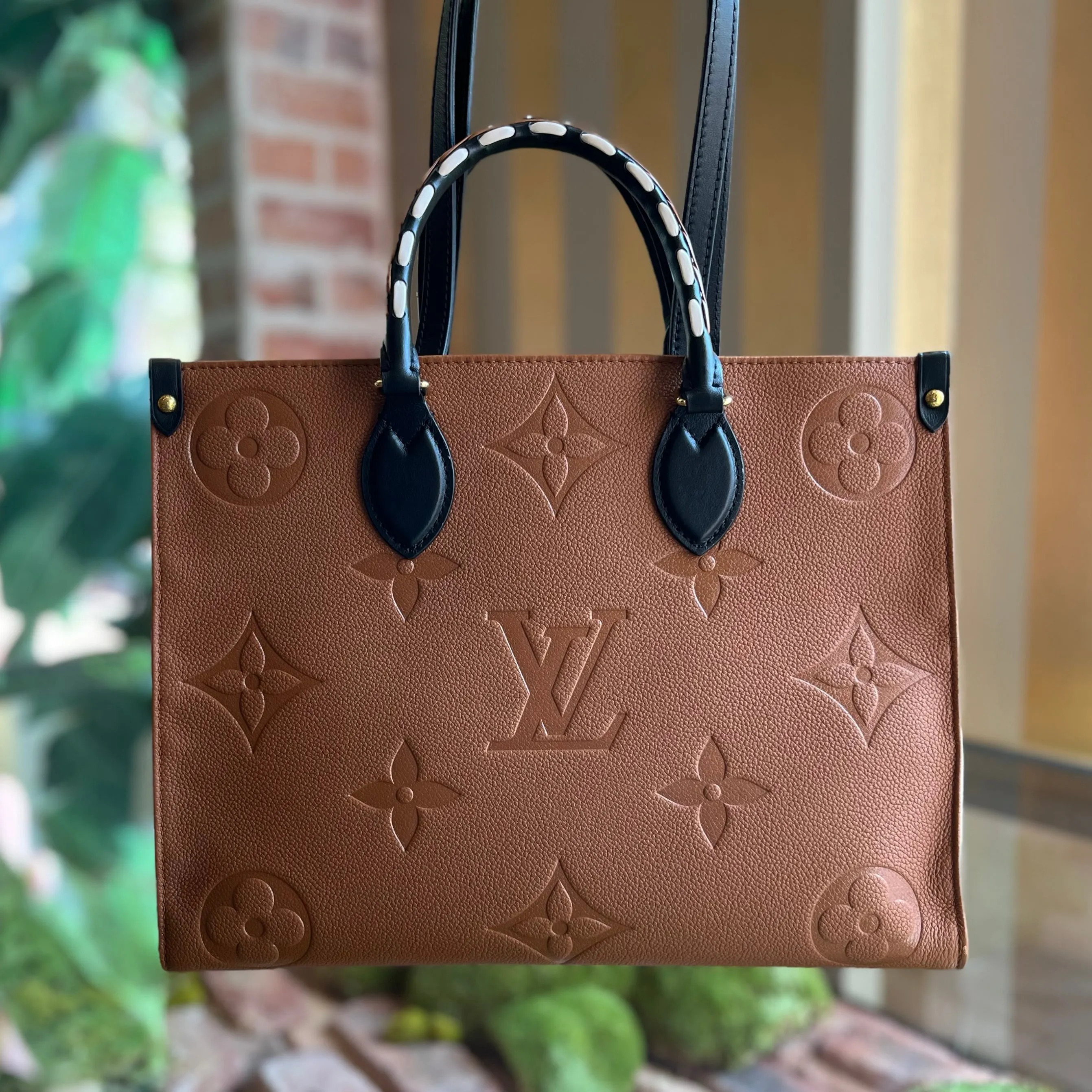 LOUIS VUITTON Onthego MM Brown Empreinte Monogram Giant Wild At Heart Tote Bag