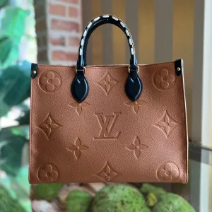 LOUIS VUITTON Onthego MM Brown Empreinte Monogram Giant Wild At Heart Tote Bag