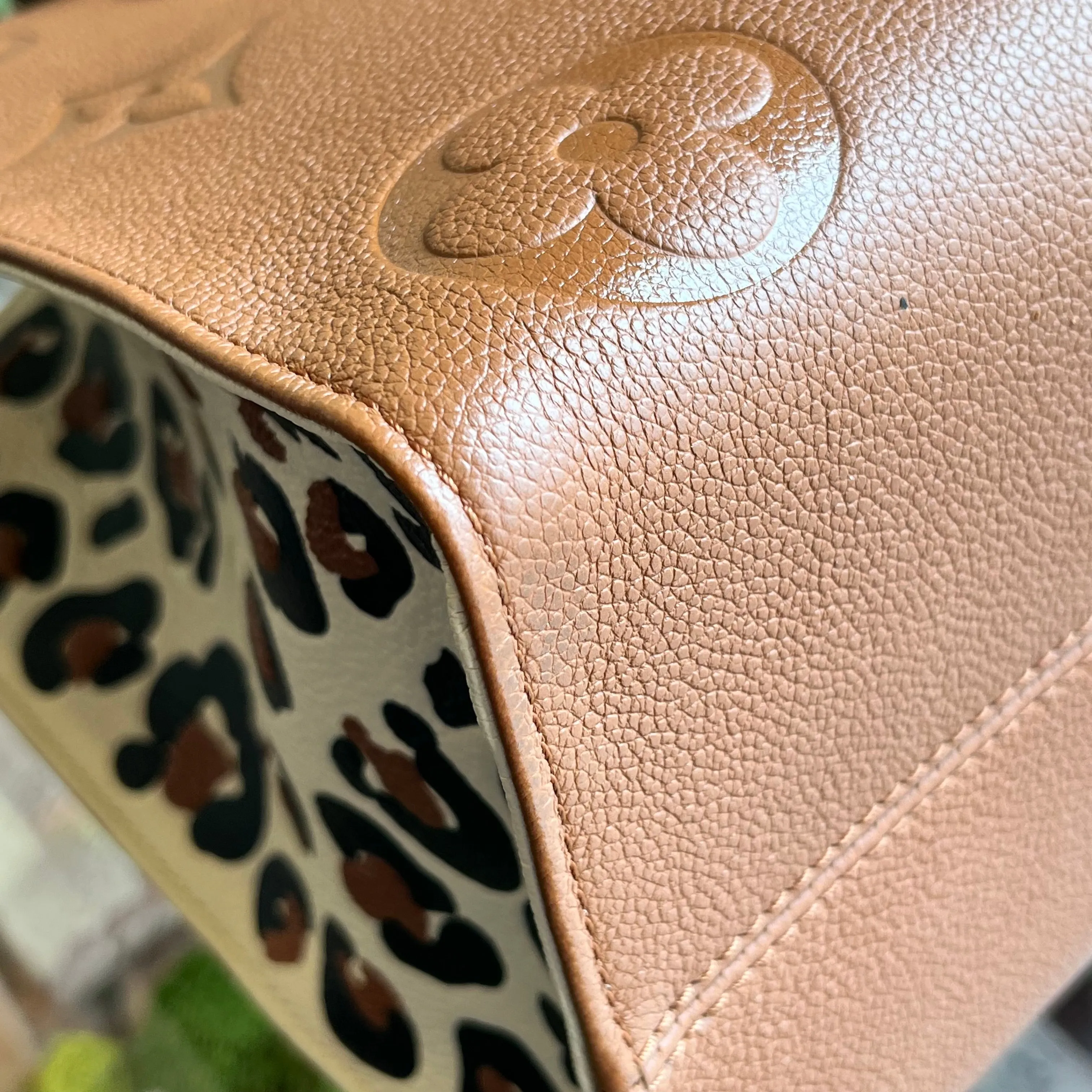 LOUIS VUITTON Onthego MM Brown Empreinte Monogram Giant Wild At Heart Tote Bag